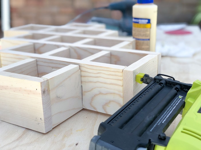 Attaching boards using brad nailer to build the DIY spice rack.