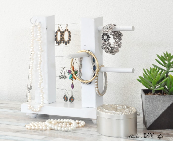Simple table top jewelry holder on desk with jewelry