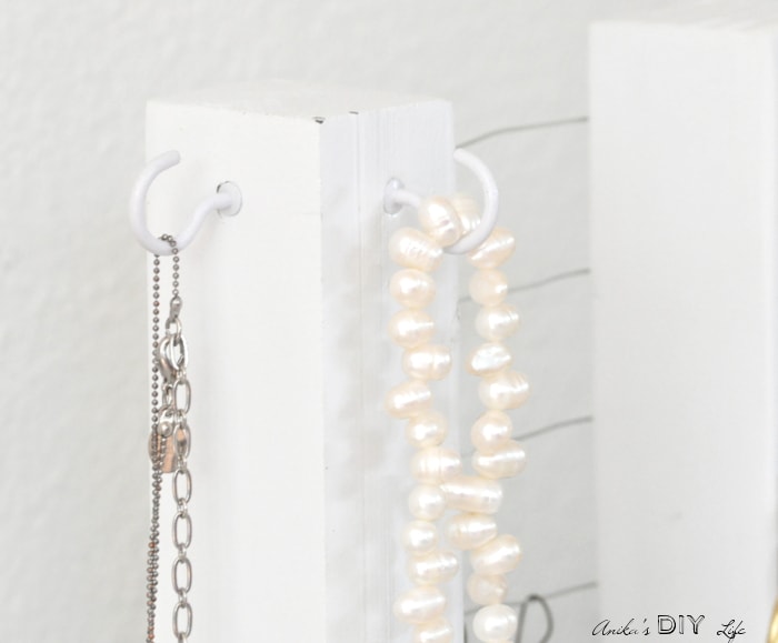 This simple jewelry holder organizes short necklaces too!