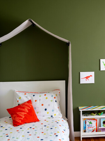Learn how to make a no-sew canvas DIY canopy tent for over the bed with this quick tutorial. Perfect for any nature-themed or little boy's room or playroom.
