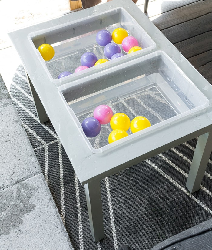 DIY water table with bins filled with water and balls