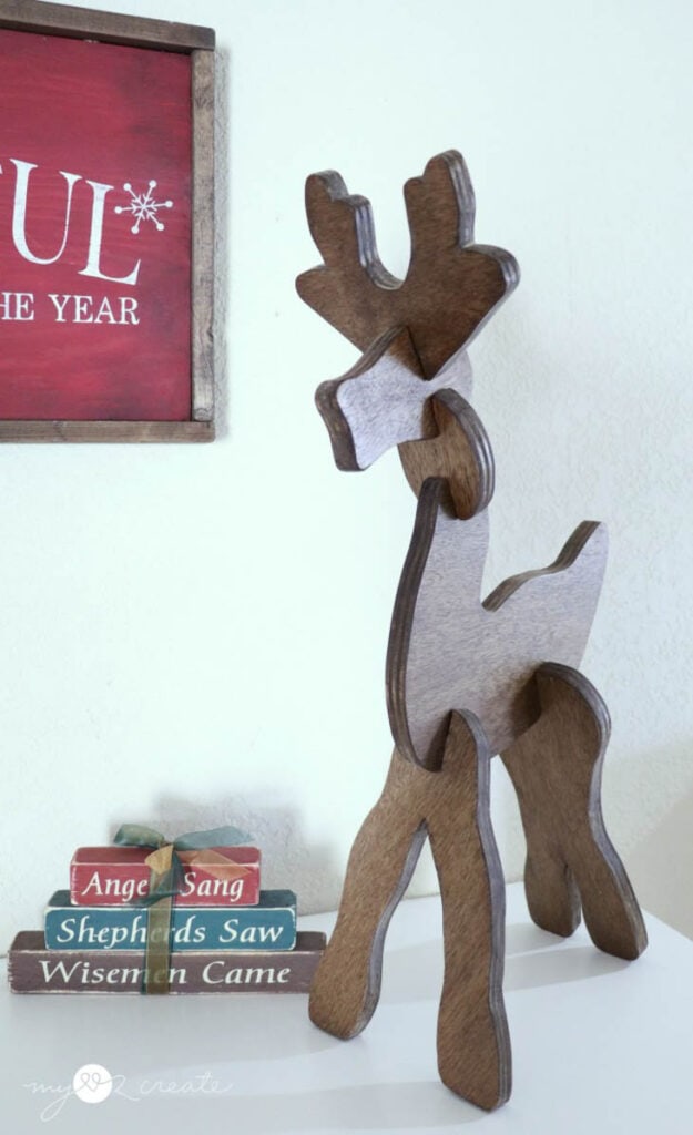 Wooden reindeer sitting on table top