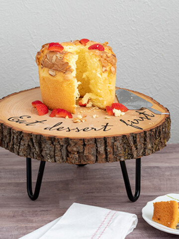 Learn how to make an easy customized DIY wood slice cake stand. The hairpin legs add rustic farmhouse charm to the gorgeous wooden cake stand. Perfect for any occasion.