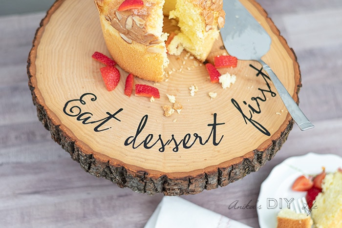 close up of cake stand with cake and words