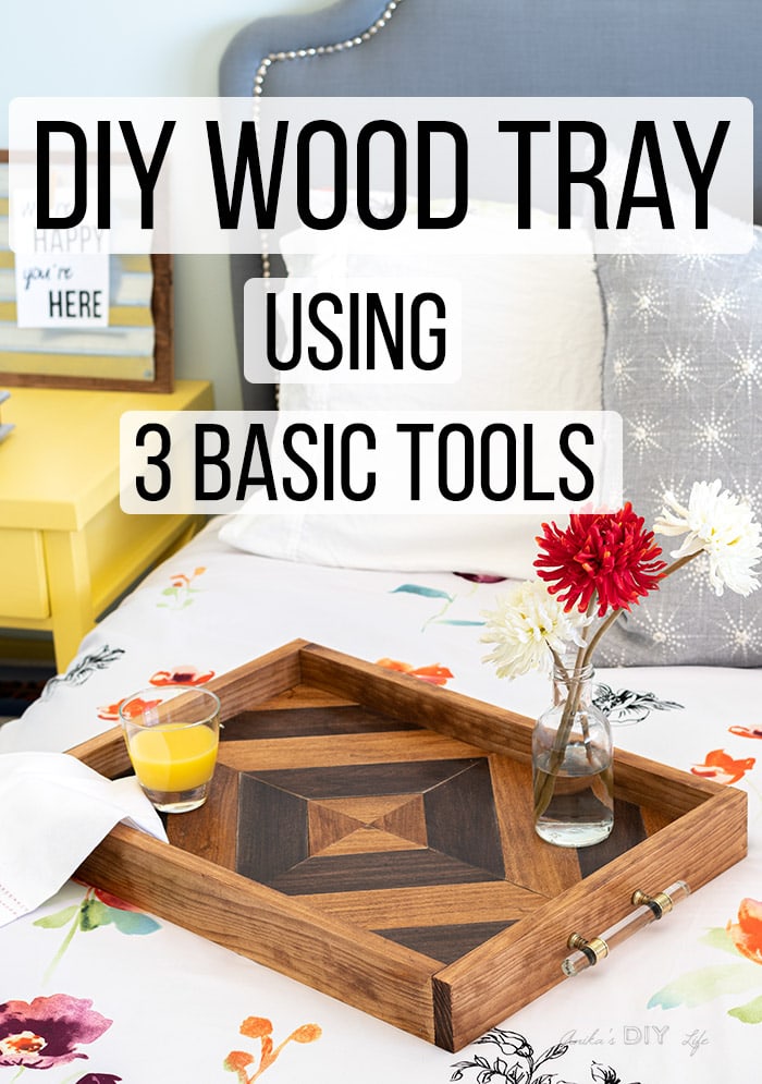 DIY wood tray on bed with orange juice and flowers