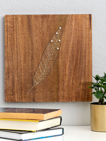 Learn to make this creative and stunning DIY wood wall art using gold wire. It's like embroidery on wood and so easy to make!