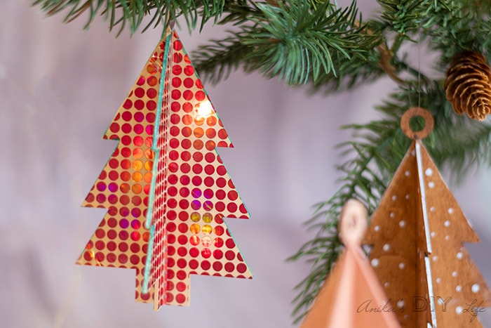 DIY wooden Christmas ornament covered in holographic vinyl.