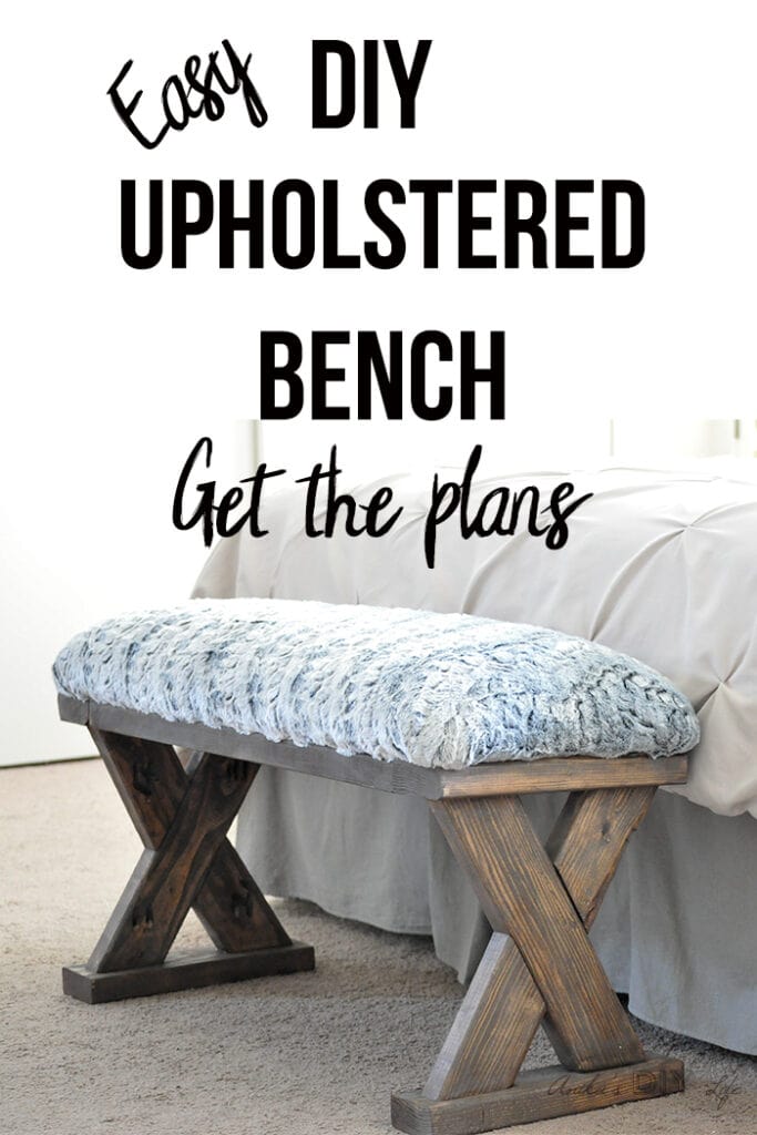 DIY 2x4 bench with upholstered top at the end of the bed with text overlay
