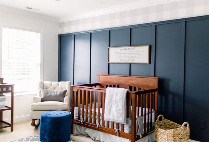 Nursery with Navy board and batten wall and grey gingham wallpaper on top