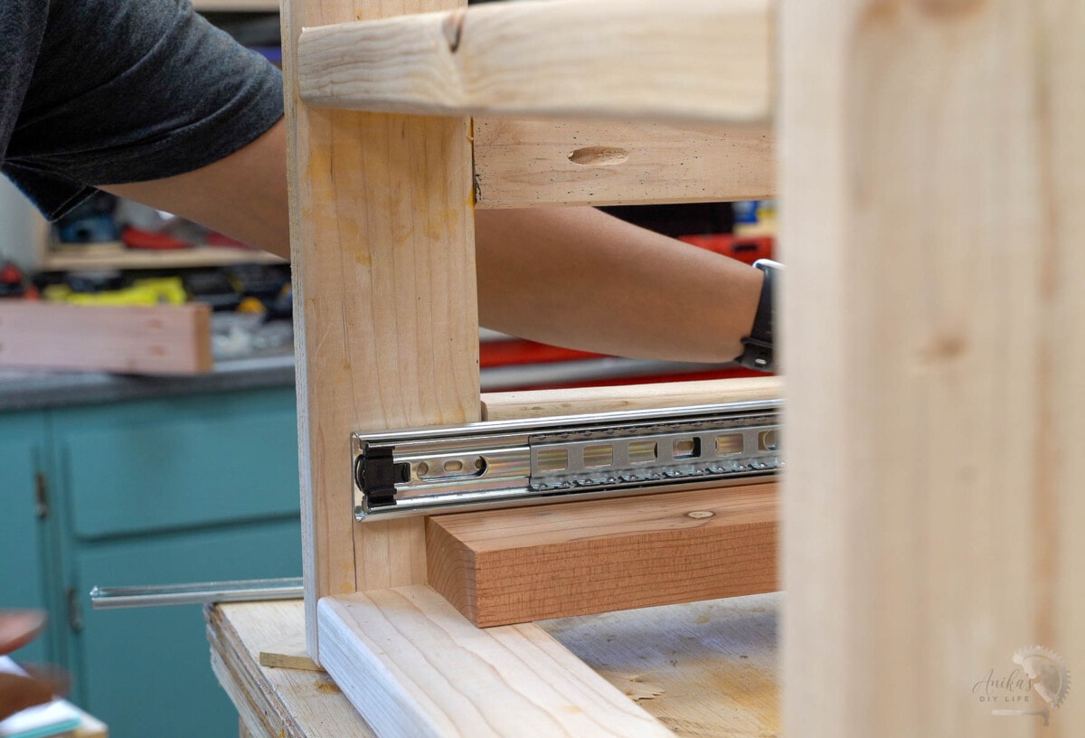 Attaching drawer slide to the frame.
