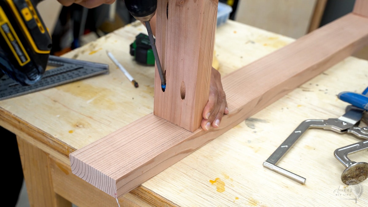 attaching the shelf supports to the legs with pocket hole screws