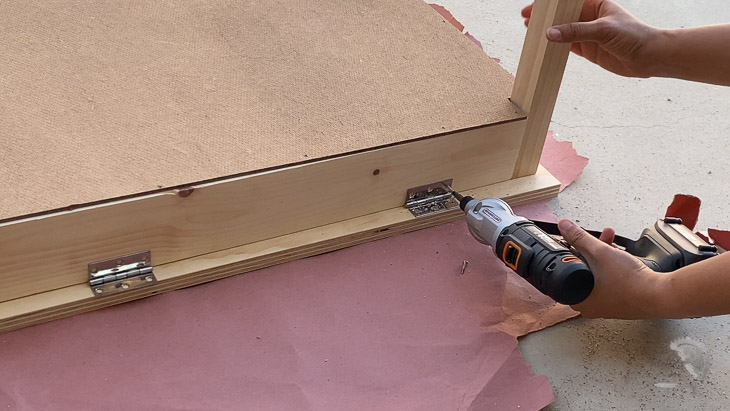 attaching hinges to the kids desk with storage