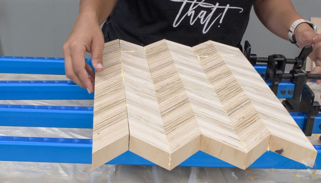Gluing up patterned plywood to make chevron plywood