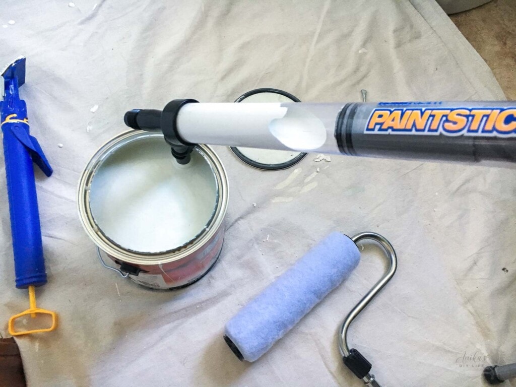 Loading the paint into the paint stick from the paint can