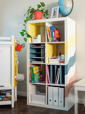 Learn how to make your own home-office, back to school, or homeschool organizer with this easy DIY Ikea Kallax Shelf hack. The DIY built-in inserts are perfect for organizing paper and folders.
