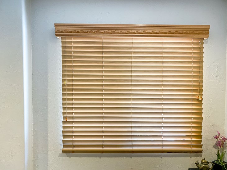 Window with old brown blinds