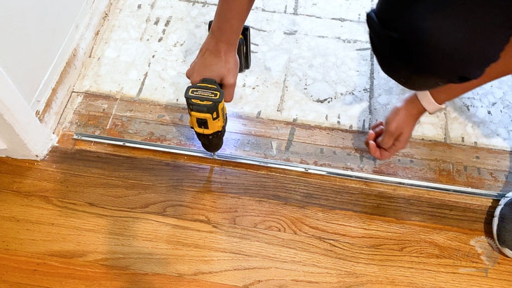 installing metal strip for transition with vinyl plank flooring
