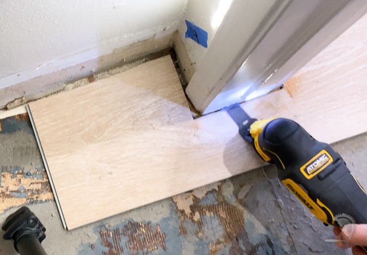Cutting under a door jamb to install vinyl plank flooring