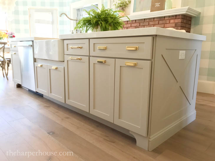large kitchen island with wood X-trim panel on the end