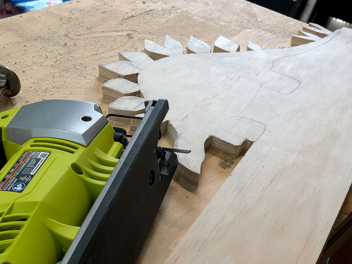 Dinosaur cut out using a jig saw for a DIY Dinosaur shelf