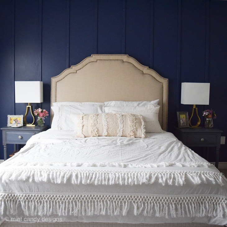Bedroom with navy board and batten accent wall using thin boards