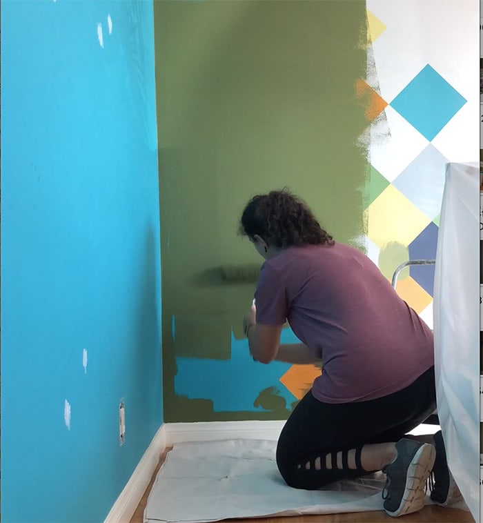painting green wall for toddler room