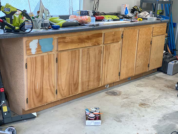 Wood veneer cabinets in garage before painting.