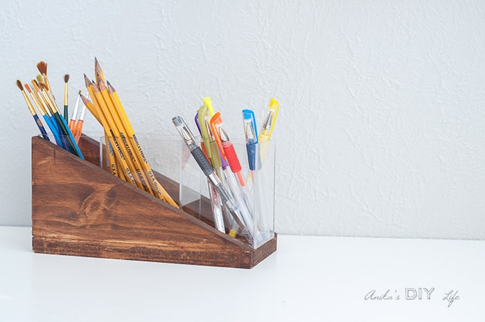 View of the completed modern diy pencil holder with pens and paintbrushes