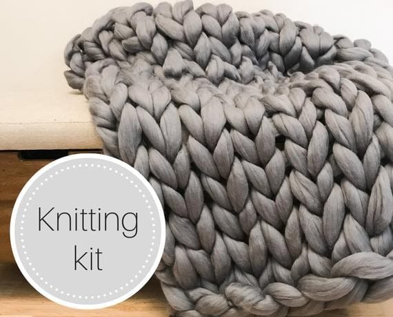 gray arm knitted blanket with text kitting kit