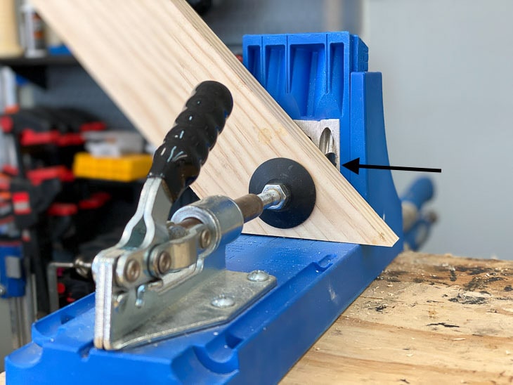 mitered board on Kreg Jig with one hole showing