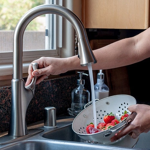 A step by step beginner's guide for how to replace a kitchen faucet. Learn how to change a kitchen faucet easily yourself and save money too!