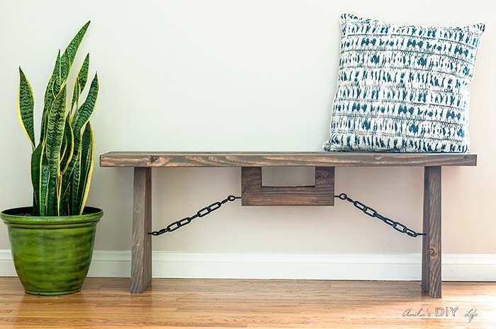 Easy DIY industrial farmhouse bench with throw pillow