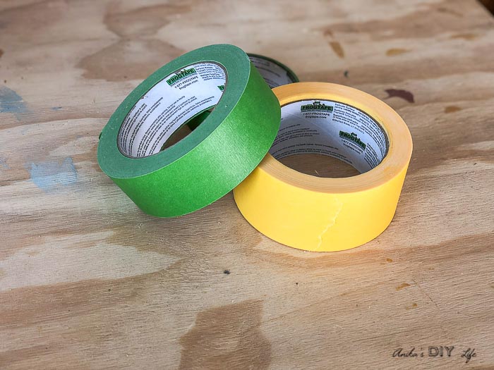 green and yellow frog tape on workbench
