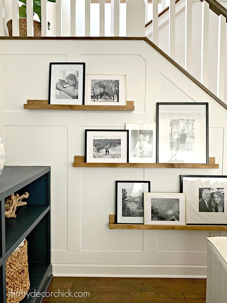 white board and batten on stair wall with picture ledges