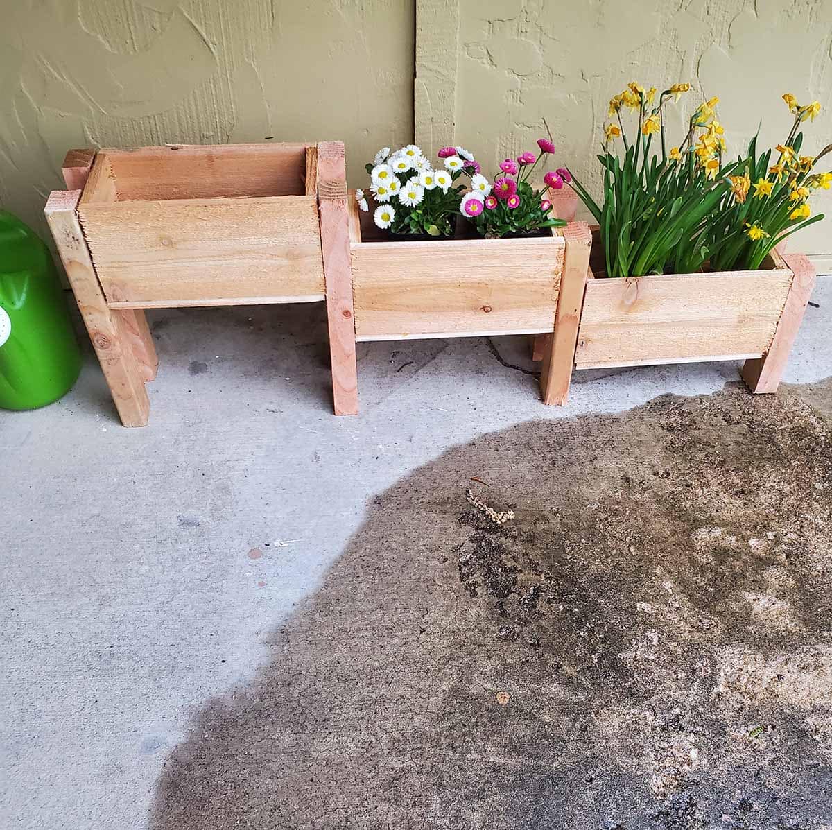 DIY tiered planter with flower on patio